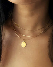 Delicate disc pendant triple layered necklace